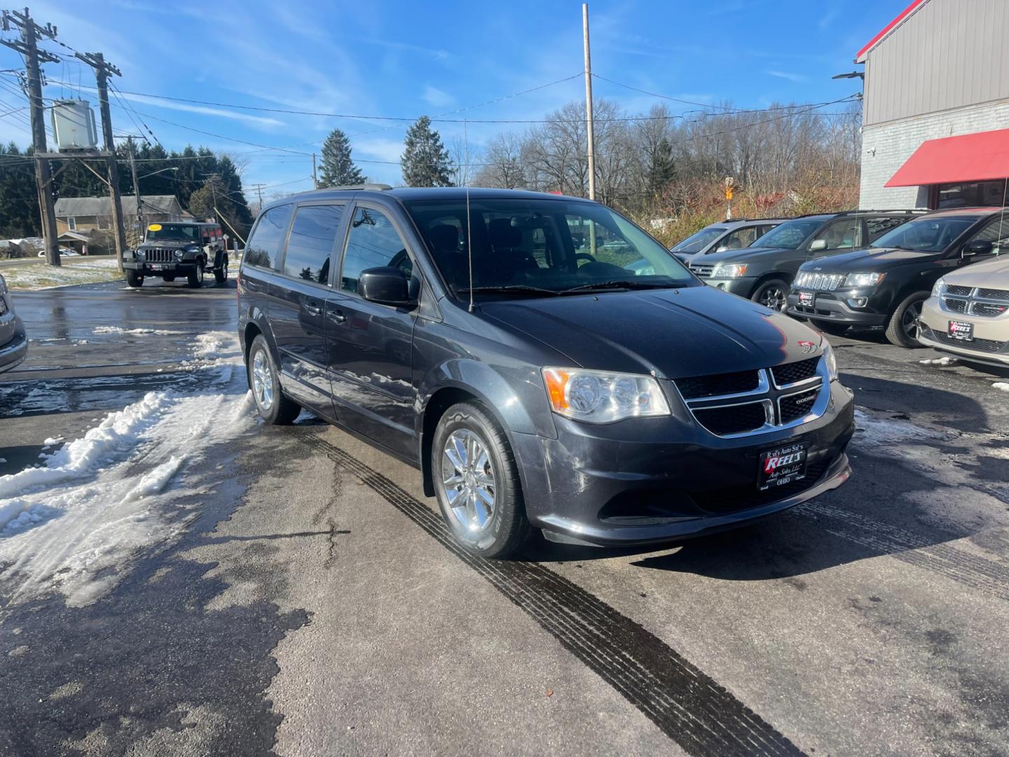 2014 Gray /Black Dodge Grand Caravan SXT (2C4RDGCG9ER) with an 3.6L V6 DOHC 24V FFV engine, 6 Speed Automatic transmission, located at 547 E. Main St., Orwell, OH, 44076, (440) 437-5893, 41.535435, -80.847855 - This 2014 Dodge Grand Caravan SXT is equipped with a rear entertainment system and STOW N GO seating, allowing for easy storage and flexibility. It also features a back-up camera, providing added convenience and safety when parking or reversing. With its versatile seating and entertainment options, - Photo#2